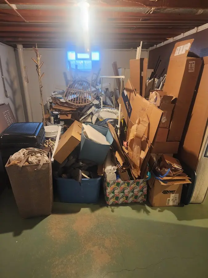 Roll-off dumpster container at job site for 8 Yard Dumpster Rental in Jensen Beach